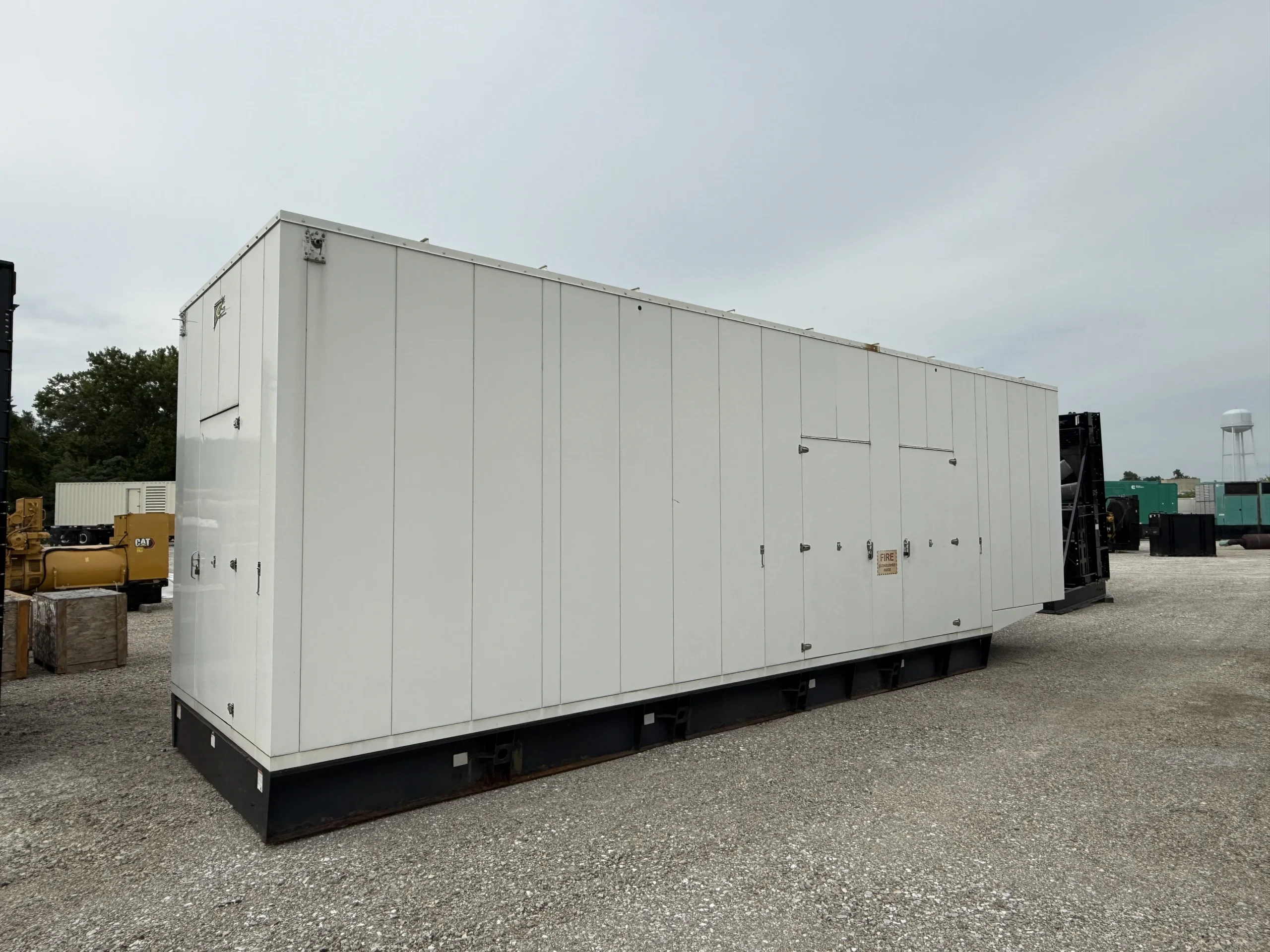 2011 CAT C27 750kW Generator Enclosure Front Left scaled 1 CAT C27 750kW 480V Diesel Generator Set - Image 2