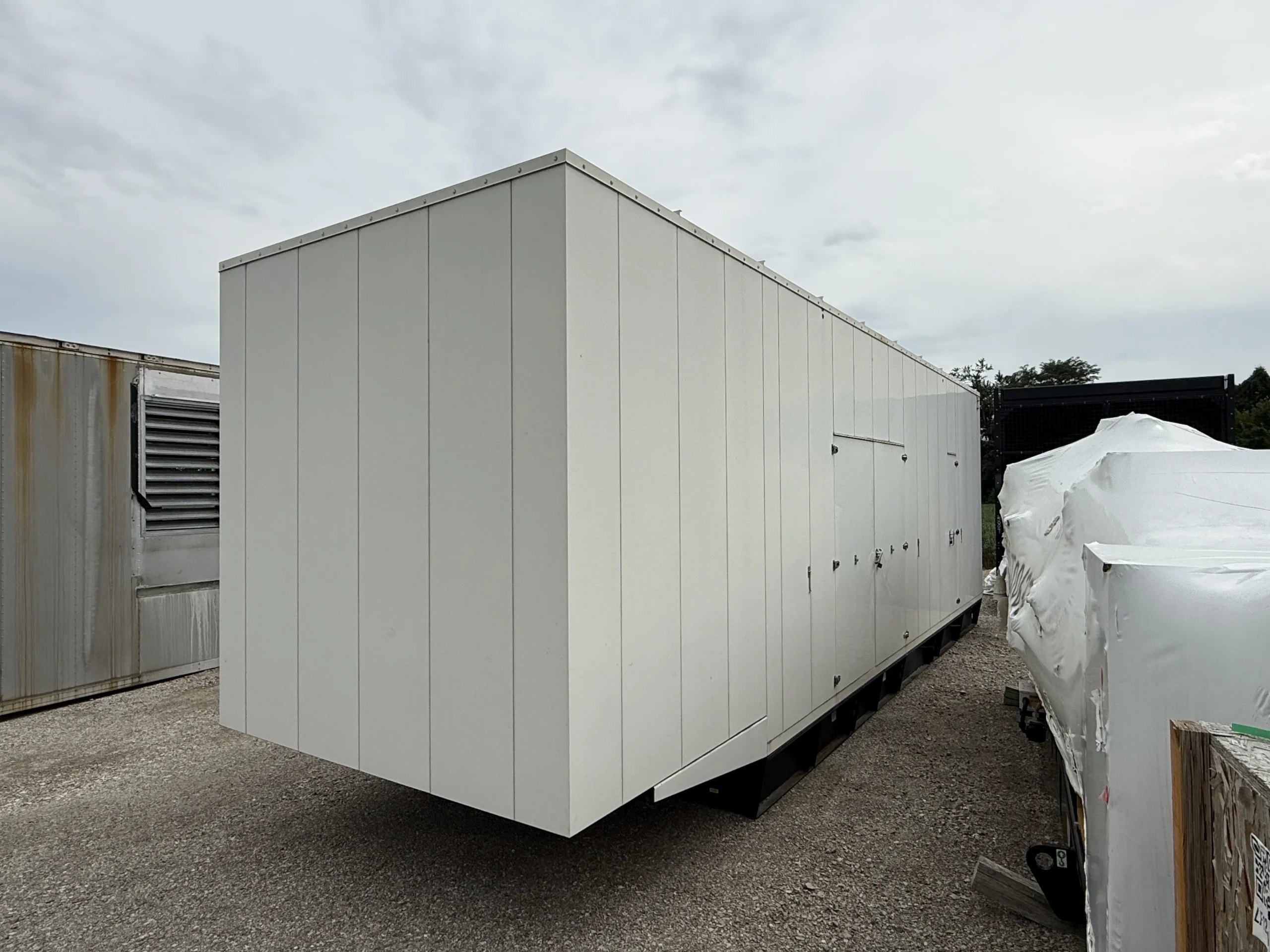 2011 CAT C27 750kW Generator Enclosure Front Right scaled 1 CAT C27 750kW 480V Diesel Generator Set - Image 3