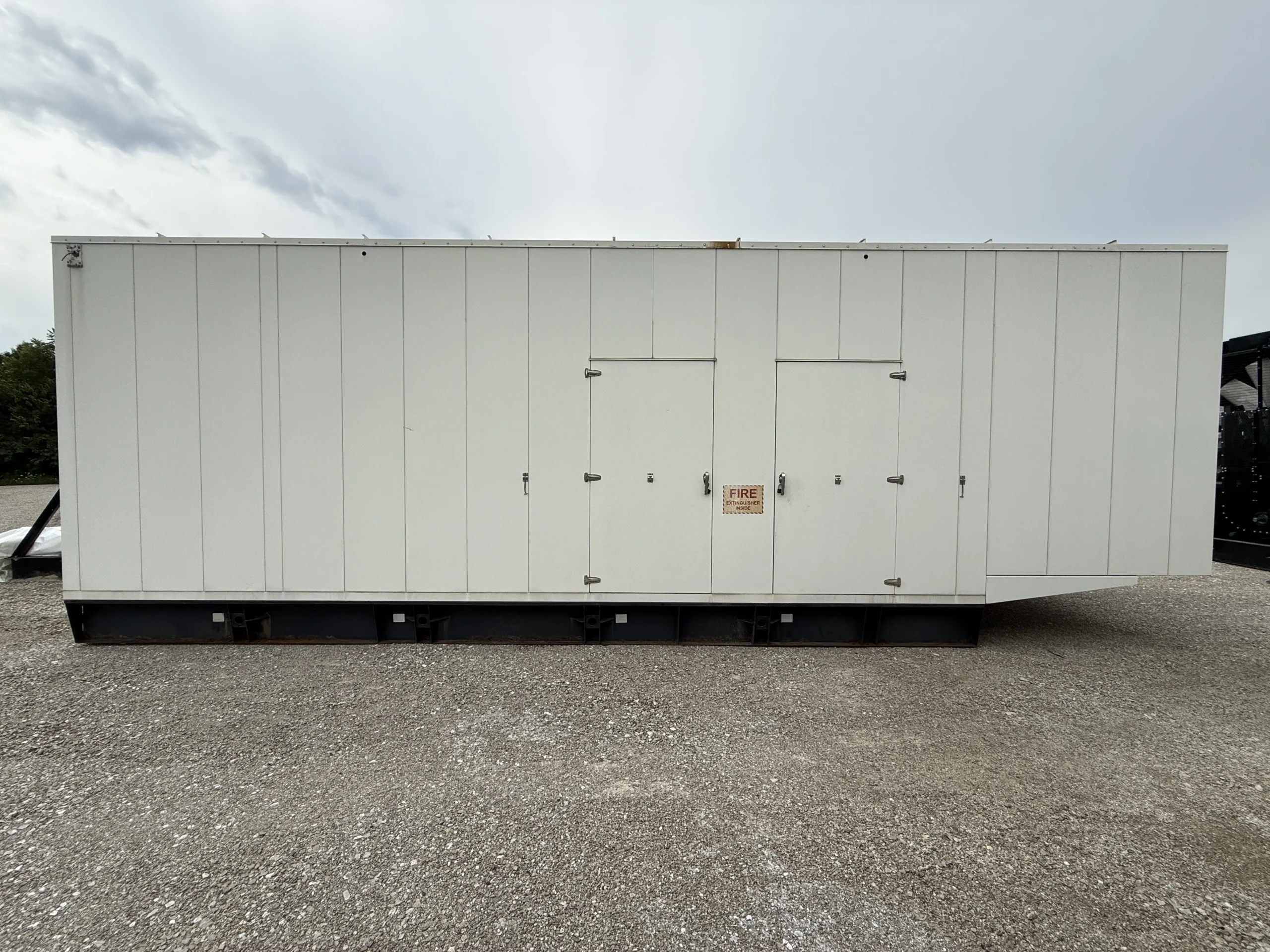 2011 CAT C27 750kW Generator Enclosure Side View scaled 1 CAT C27 750kW 480V Diesel Generator Set